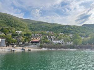 a small town on the shore of a body of water at Natyra te Eti in Shkodër