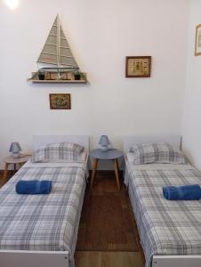 Postel nebo postele na pokoji v ubytování Adriatica Apartments