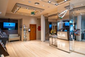 a store with a display case in a mall at Abba Rambla Hotel in Barcelona