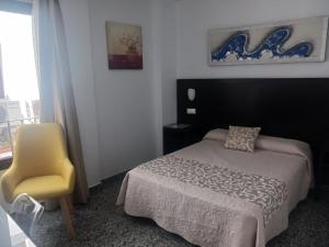 Posteľ alebo postele v izbe v ubytovaní Hotel de Los Faroles