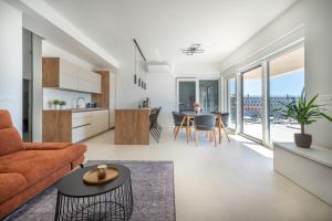 a living room with a couch and a table at Villa La Vista e Bella in Kožino
