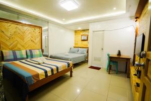 Katil atau katil-katil dalam bilik di JEMZ Tagaytay Budget Rooms