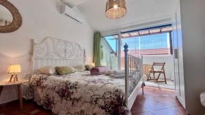 a bedroom with a bed and a window at Edita Apartments in Tivat