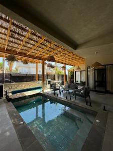a house with a swimming pool in the middle at Diamond in the Desert- for families in Eilat