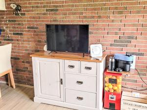 TV a/nebo společenská místnost v ubytování Holiday Home Klaffmuschel by Interhome
