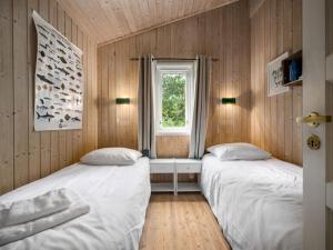 Postel nebo postele na pokoji v ubytování Holiday Home Granlien by Interhome