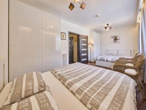 a bedroom with two beds and a bed sidx sidx sidx sidx sidx at Apartment Horní Mísečky-2 by Interhome in Vítkovice