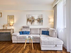 a living room with a couch and a table at Apartment Horní Mísečky-2 by Interhome in Vítkovice