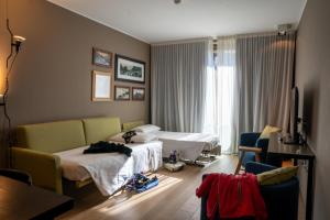 Rúm í herbergi á Parc Hotel Billia