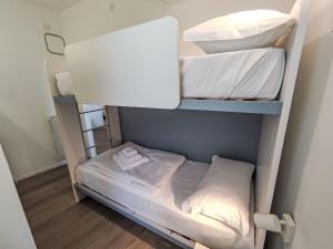 a small room with a bunk bed in it at Apartment Garda Sapphire by Interhome in Riva del Garda