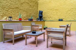a room with chairs and a table and a cat statue at Abba Rambla Hotel in Barcelona