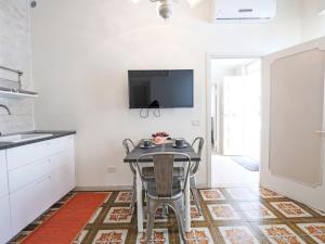 A television and/or entertainment centre at Apartment Aloe by Interhome
