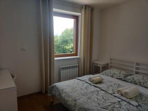 Postel nebo postele na pokoji v ubytování Prenočišča Center Mir In Dobro