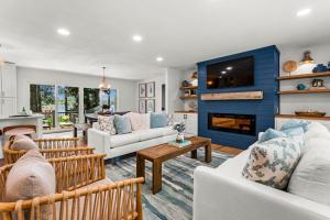 a living room filled with furniture and a fireplace at Lakefront Living w/Optional Boat Rental in Mooresville