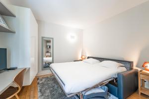 Postel nebo postele na pokoji v ubytování Superbes Studios - Place des Quinconces