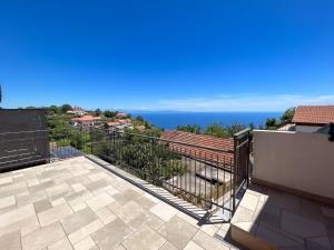 a balcony with a view of the ocean at Casa Milly in Agerola