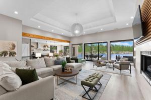 a living room with a couch and a fireplace at Salience Path w/Heated Pool & Game Room in Mooresville