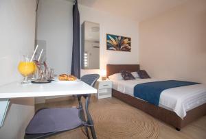 Postel nebo postele na pokoji v ubytování Studio Apartmani M