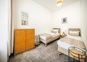 Postel nebo postele na pokoji v ubytování Residence Vyhlídka