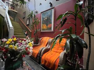 a bedroom with a bed with flowers and a staircase at La Casona de Palacio Viejo in Arequipa