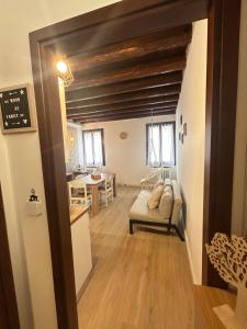 a living room with a couch and a table at Wood 32 family -jvapartmentRovigo in Rovigo