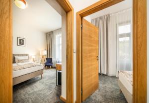 Postel nebo postele na pokoji v ubytování Residence Vyhlídka