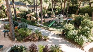 an aerial view of a garden with a playground at Les Maisons Du Sud in Saint-Tropez