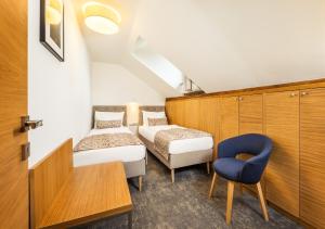 Postel nebo postele na pokoji v ubytování Residence Vyhlídka