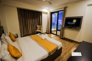 Voodi või voodid majutusasutuse BlueNeck Sec 40 Unitech Cyber Park Gurugram toas