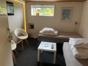 Postel nebo postele na pokoji v ubytování Skagentoppen Rooms