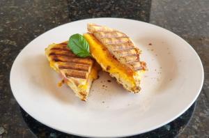 a white plate with two waffles on a table at The View Randalstown in Randalstown +10 photos