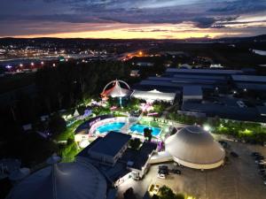 an overhead view of a pool at night at ROYAL PARK Complex in Bascov