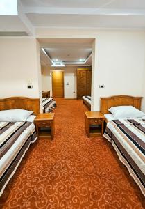 Mali Hotel BaMBiS客房内的一张或多张床位