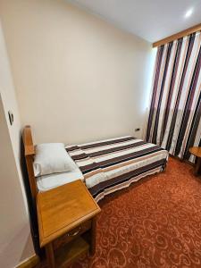 Mali Hotel BaMBiS客房内的一张或多张床位