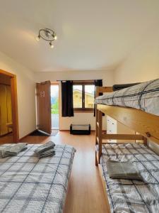 Postel nebo postele na pokoji v ubytování La Tzoum'hostel