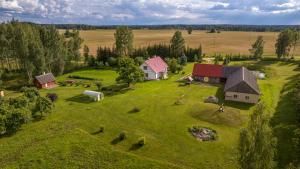 an aerial view of a farm with houses and hay at Kure talu Glämping Setomaal in Polovina