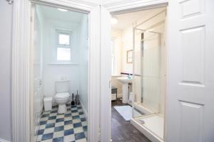 a bathroom with a toilet and a sink at Pebbles guest house room 18 in Southampton