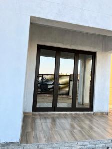 a window on the side of a white building at Vinview 4-bedroom holiday home in Swakopmund