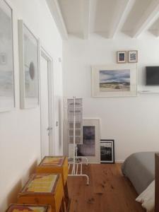 a bedroom with white walls and a bed and a table at 2409 parma in Parma