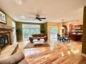 a living room with a couch and a fireplace at Redbud Retreat in Centerville
