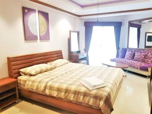 Postel nebo postele na pokoji v ubytování SeaView Floor 11 Jomtien Beach