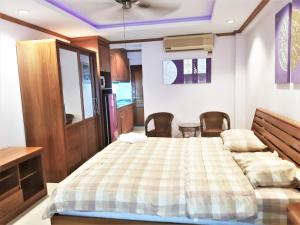 Postel nebo postele na pokoji v ubytování SeaView Floor 11 Jomtien Beach + 13 fotografií