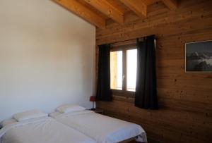Postel nebo postele na pokoji v ubytování La Tzoum'hostel