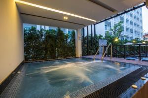 a indoor swimming pool in a building at Kantary 304 Hotel Prachinburi in Si Maha Phot
