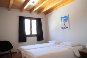 Postel nebo postele na pokoji v ubytování La Tzoum'hostel