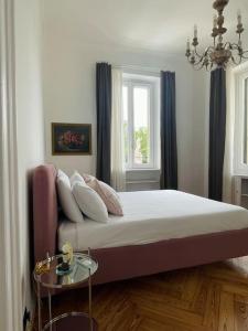a bedroom with a bed and a window at L'Adagio in Gran Madre in Turin