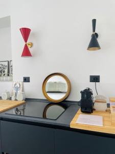 a counter with a mirror on top of it at L'Adagio in Gran Madre in Turin