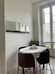 a dining room with a table and some chairs at L'Adagio in Gran Madre in Turin