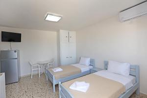 Postel nebo postele na pokoji v ubytování Aira Apartments