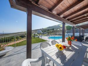 a patio with a table and chairs and a pool at Apartment Alba Marina by Interhome in Citta' Sant'Angelo +18 photos